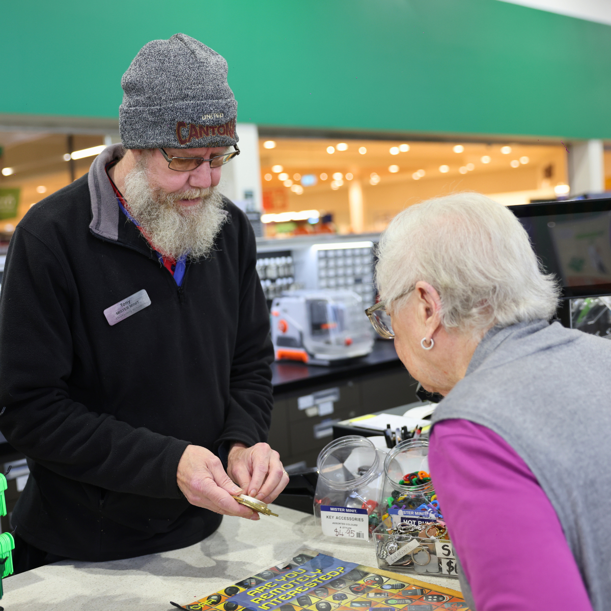 Tony helping a customer at Mister Minit Cleveland Central