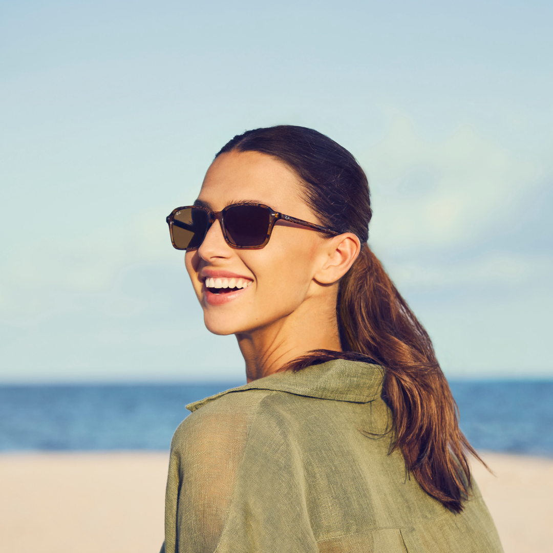Woman wearing sunglasses at the beach